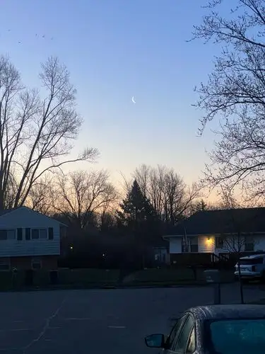 Twilight peace, highlighted by the crescent moon.